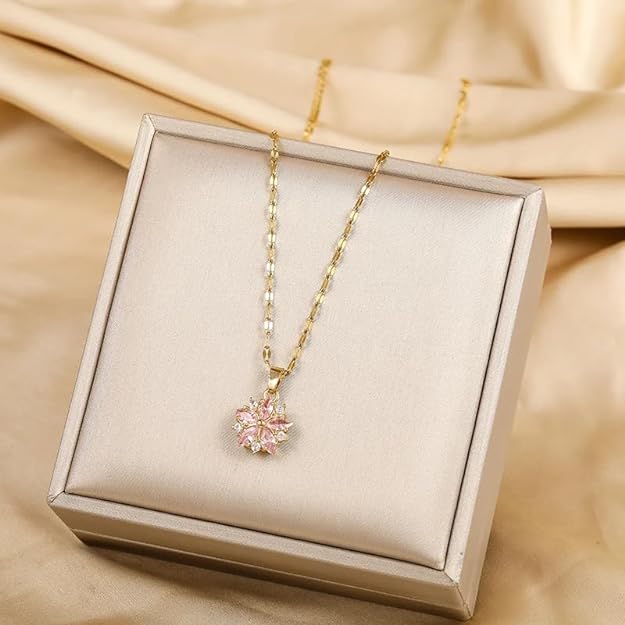 Gold plated necklace with flower pendant, elegant jewelry piece for special occasions.