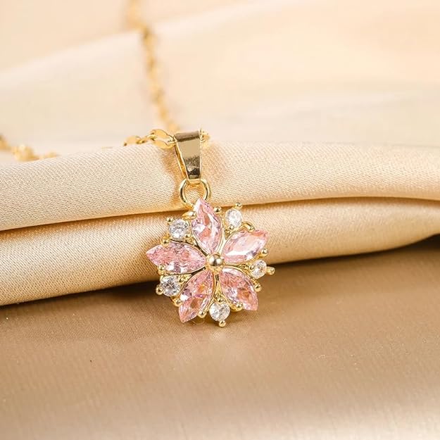 Elegant gold plated necklace adorned with a beautiful flower, ideal for dressing up.