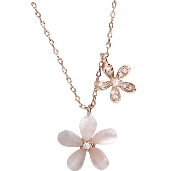 Stylish white floral necklace with pink accent.