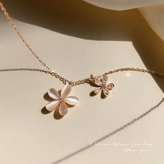 A pink and white flower necklace.