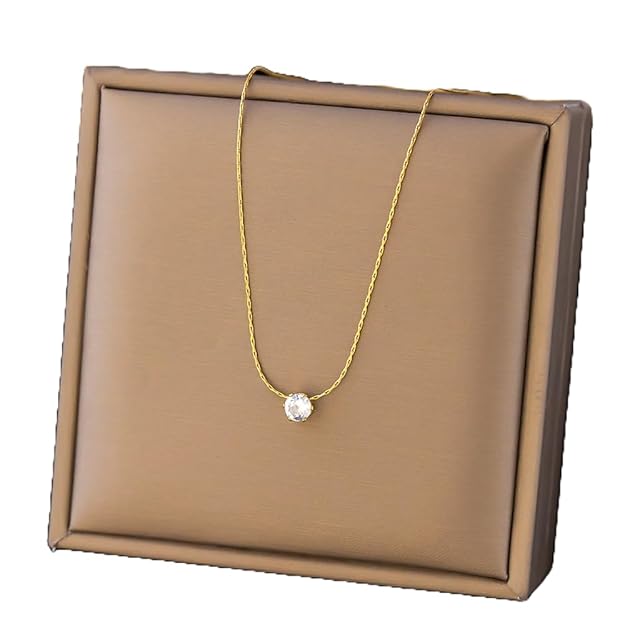  Stunning white diamond set in a gold plated necklace, exuding luxury.