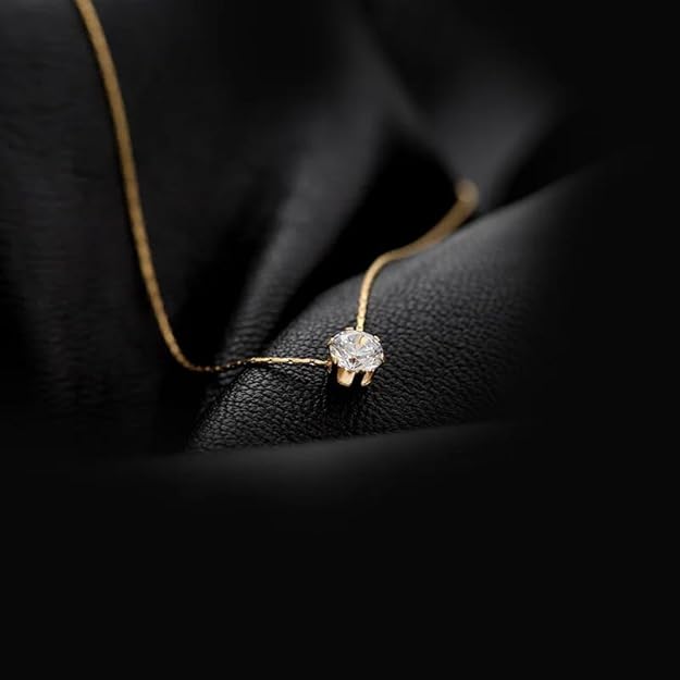 Luxurious gold plated necklace featuring a stunning white diamond centerpiece.