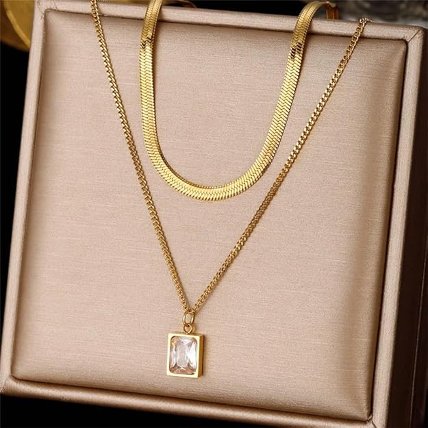 Elegant gold necklace with square pendant, beautifully presented in a gift box.