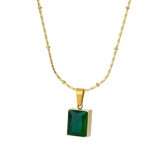 Gold plated pendant with emerald stone, a beautiful and eye-catching accessory.