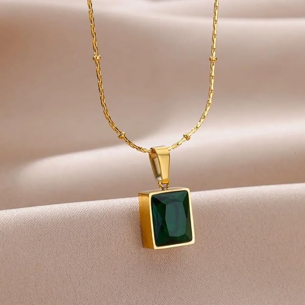  Gold plated square pendant with emerald stone, elegant and luxurious jewelry piece.