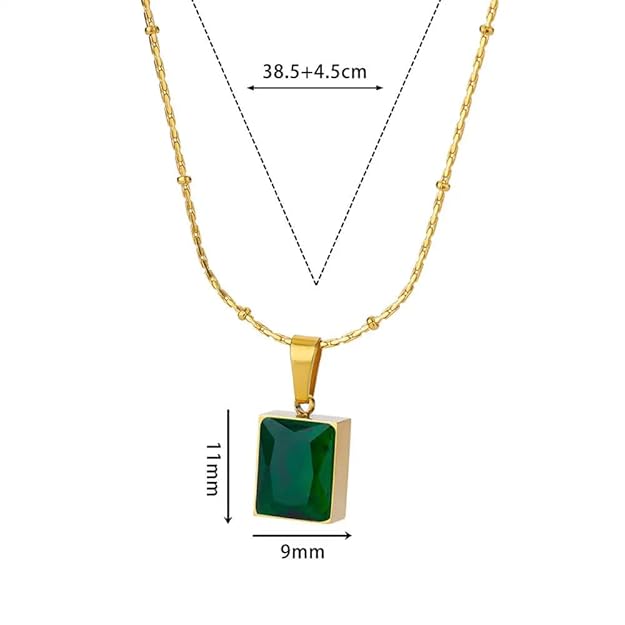 A green stone pendant on a gold chain.