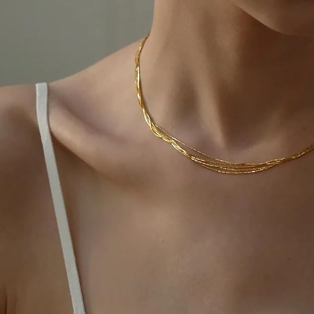 Gold chain necklace in brown box, perfect gift for special occasions.