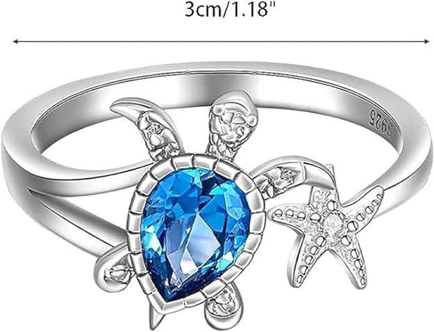 Adorable turtle ring adorned with blue topaz and a starfish.