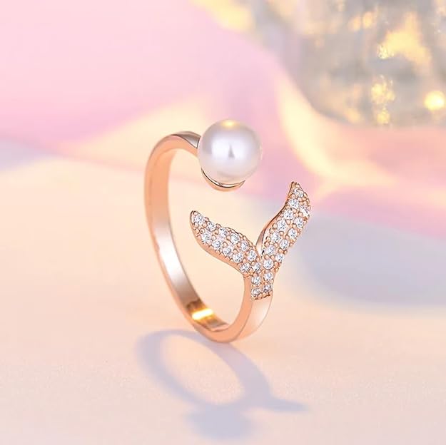 A gold plated ring with a pearl and diamond