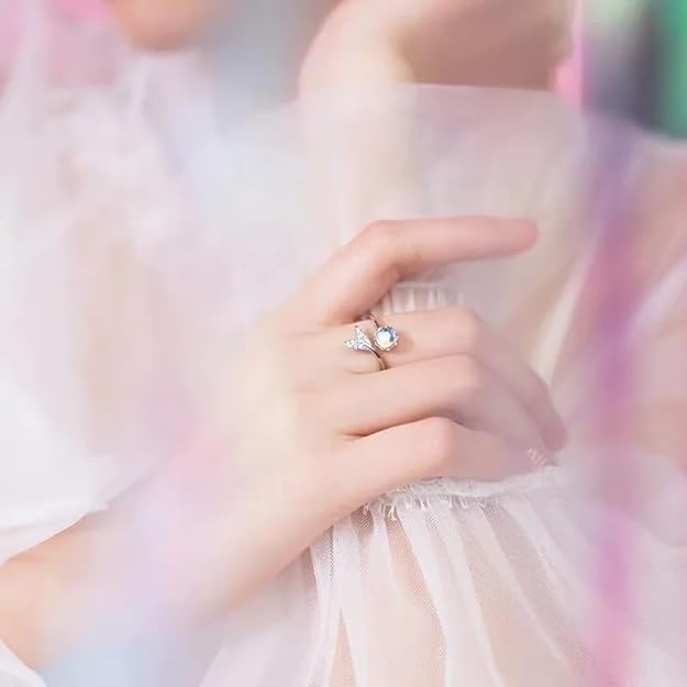 A gorgeous ring showcasing a blue moonstone and a shimmering diamond.