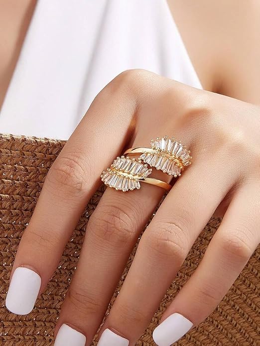 Elegant gold ring featuring delicate leaf motif, ideal for special occasions.