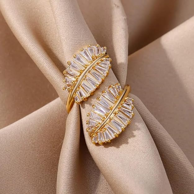  Beautiful gold ring with intricate leaf design, a stunning accessory.