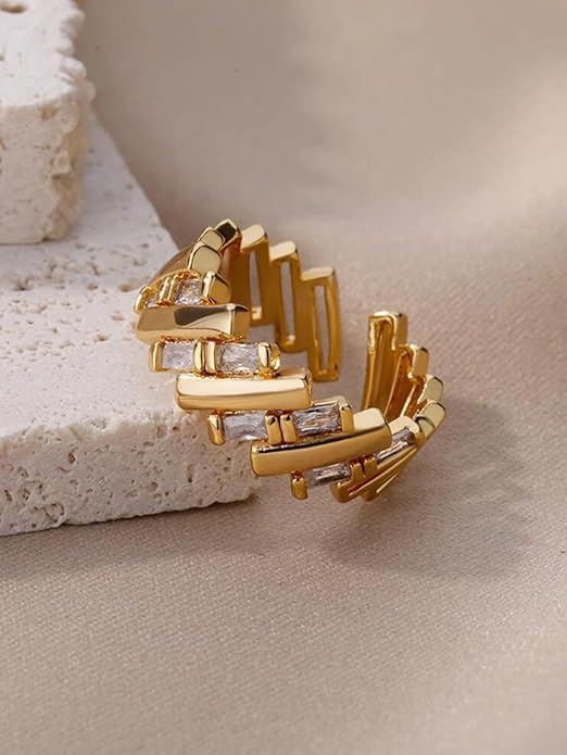 Elegant gold ring adorned with three rows of dazzling diamonds.