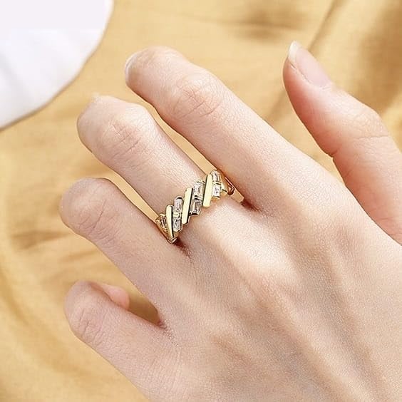 Stunning gold plated ring featuring three rows of shimmering diamonds.