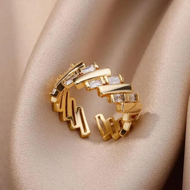 A luxurious gold ring with three rows of sparkling diamonds.