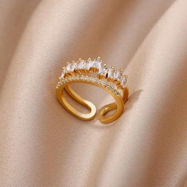 A shiny gold ring adorned with sparkling white stones.