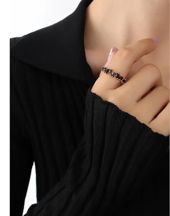 Elegant gold ring with black diamond, a stunning accessory that exudes sophistication and style.