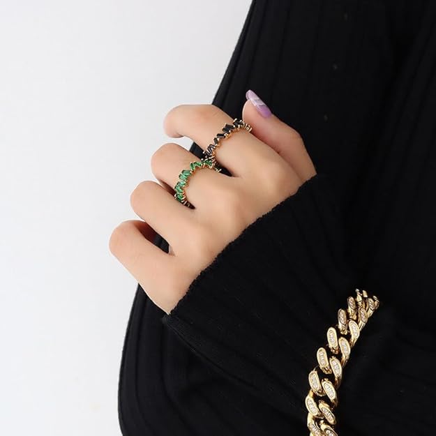 This exquisite gold ring features a striking black diamond, making it a standout accessory.