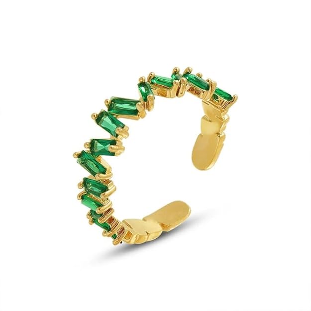 Elegant gold ring featuring beautiful emerald gemstones.