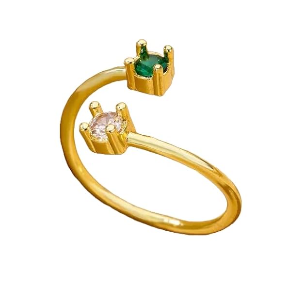 Stylish gold ring adorned with two green stones.