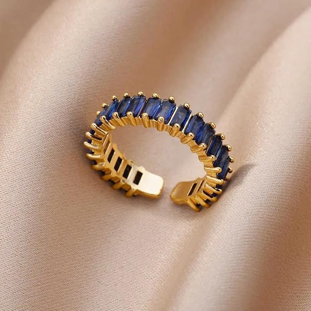 Elegant blue and gold ring featuring a dazzling stone.