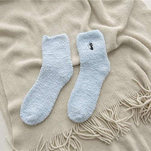 A pair of blue socks featuring a cute cat design, perfect for adding a playful touch to your outfit.