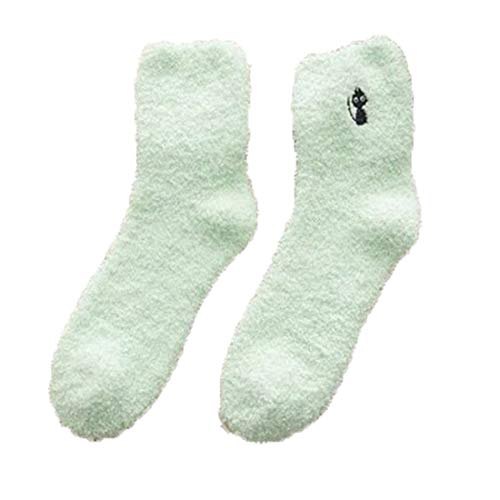 A pair of green socks featuring a cute cat design, perfect for adding a playful touch to your outfit.