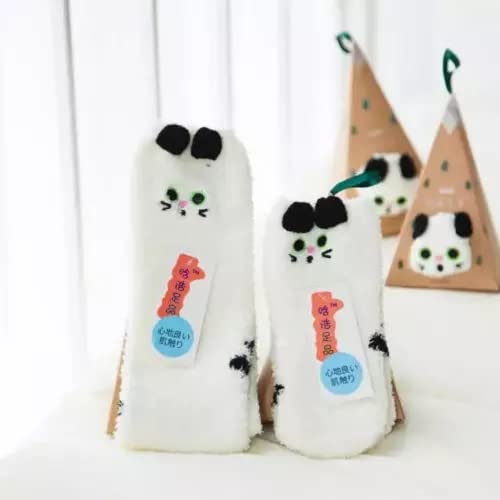 A pair of white socks featuring playful black eyes, adding a fun touch to your outfit.