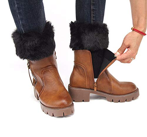 A woman is putting on stylish boots adorned with fur cuffs, preparing for a fashionable outing.