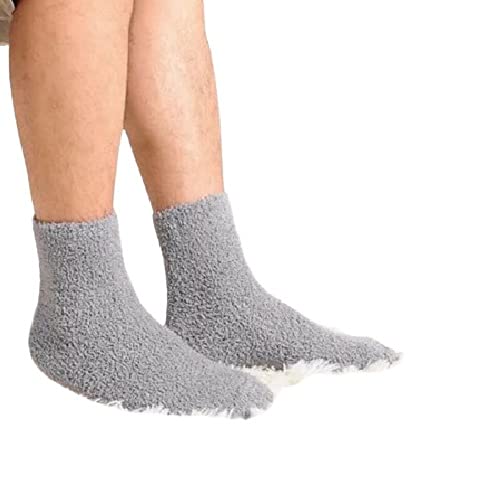 A cozy person relaxing at home, wearing soft grey fuzzy socks that add warmth and comfort to their day.
