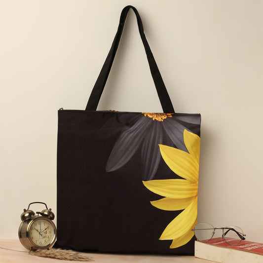 Stylish black and yellow flower tote bag with a beautiful floral pattern, ideal for carrying your essentials in style