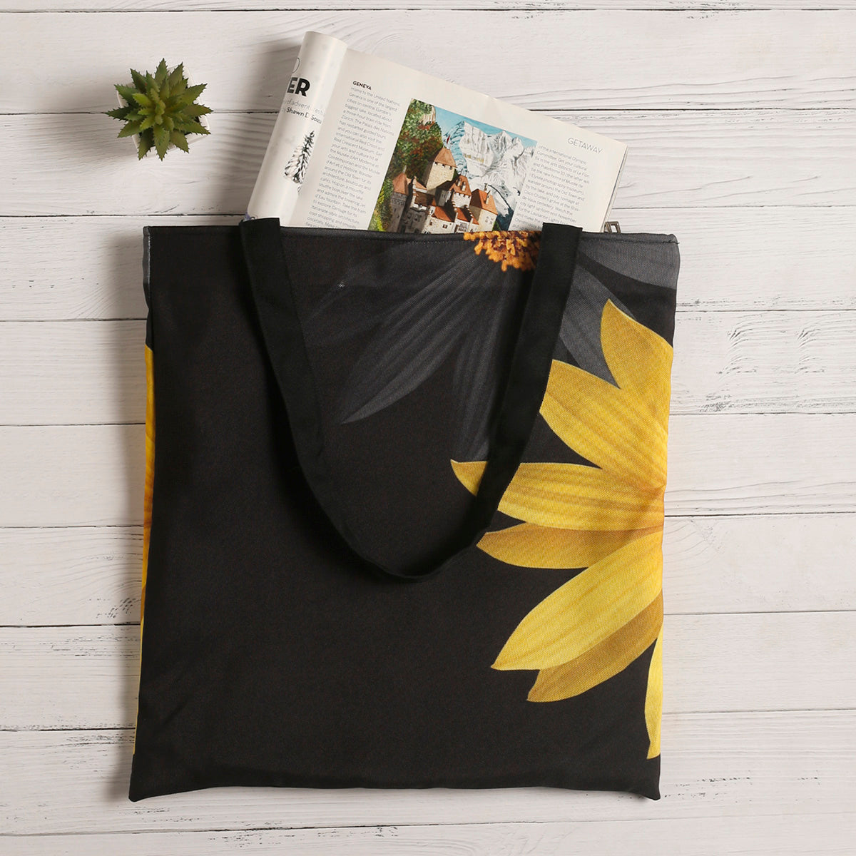 Black and yellow tote bag with floral design.