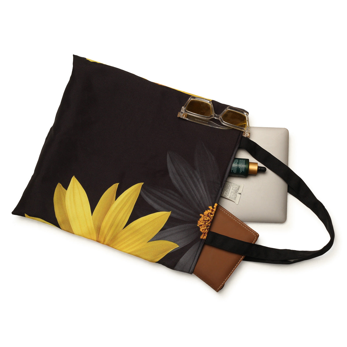 A flower print tote bag in black and yellow.