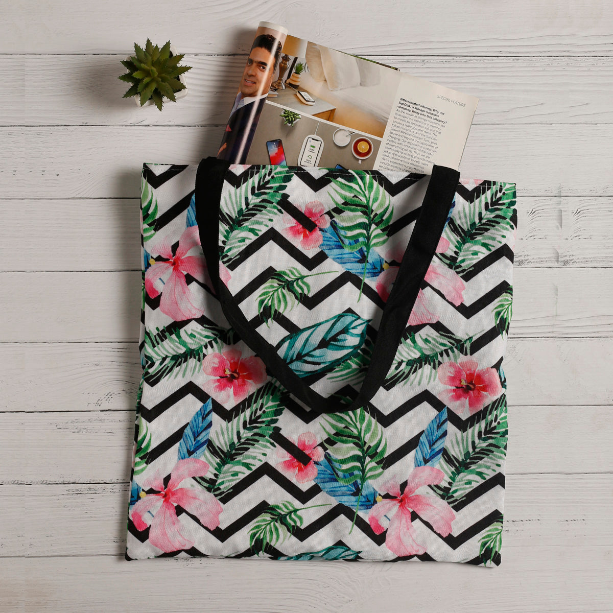  Vibrant tote bag featuring a tropical design, ideal for carrying essentials.