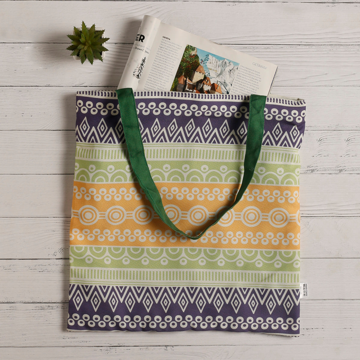 Vibrant tote bag featuring a green handle, ideal for adding a pop of color to your outfit.