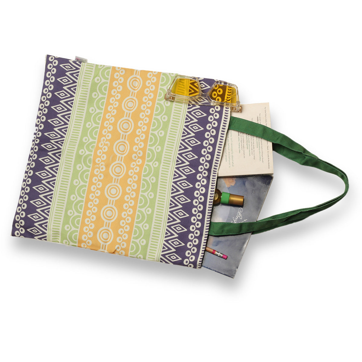 Colorful tote bag with a green handle.