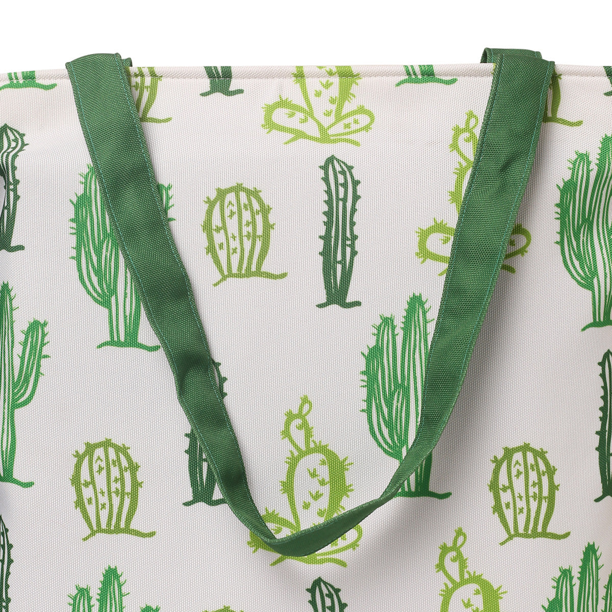 A stylish green and white tote bag featuring a fun cactus print, perfect for casual outings or grocery shopping.