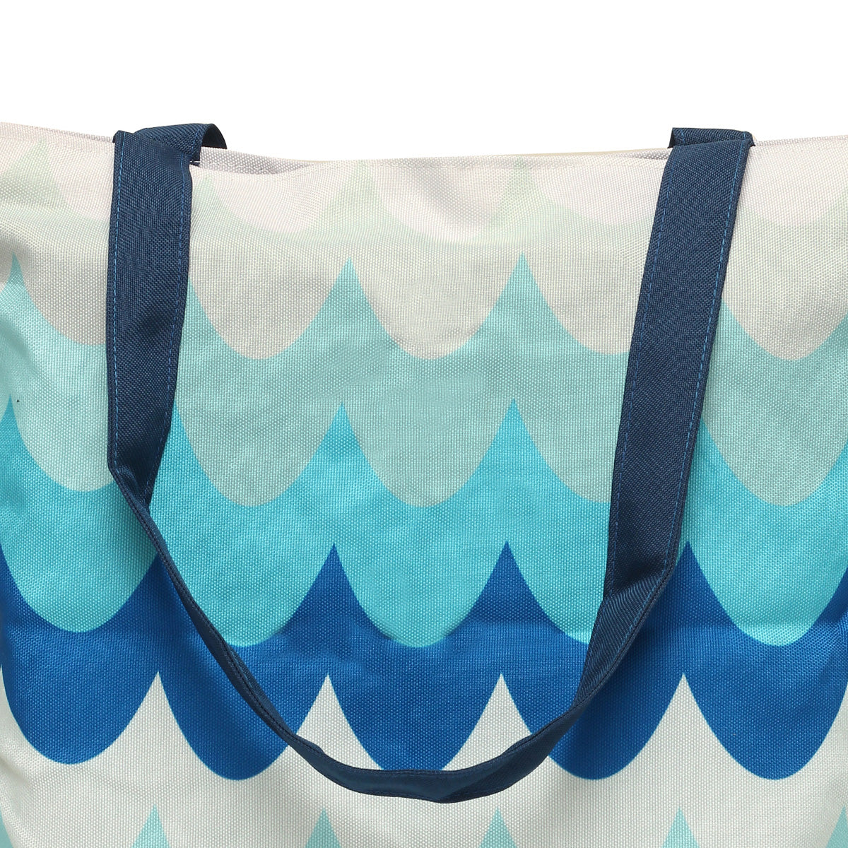 Tote bag with blue and white wave motif.