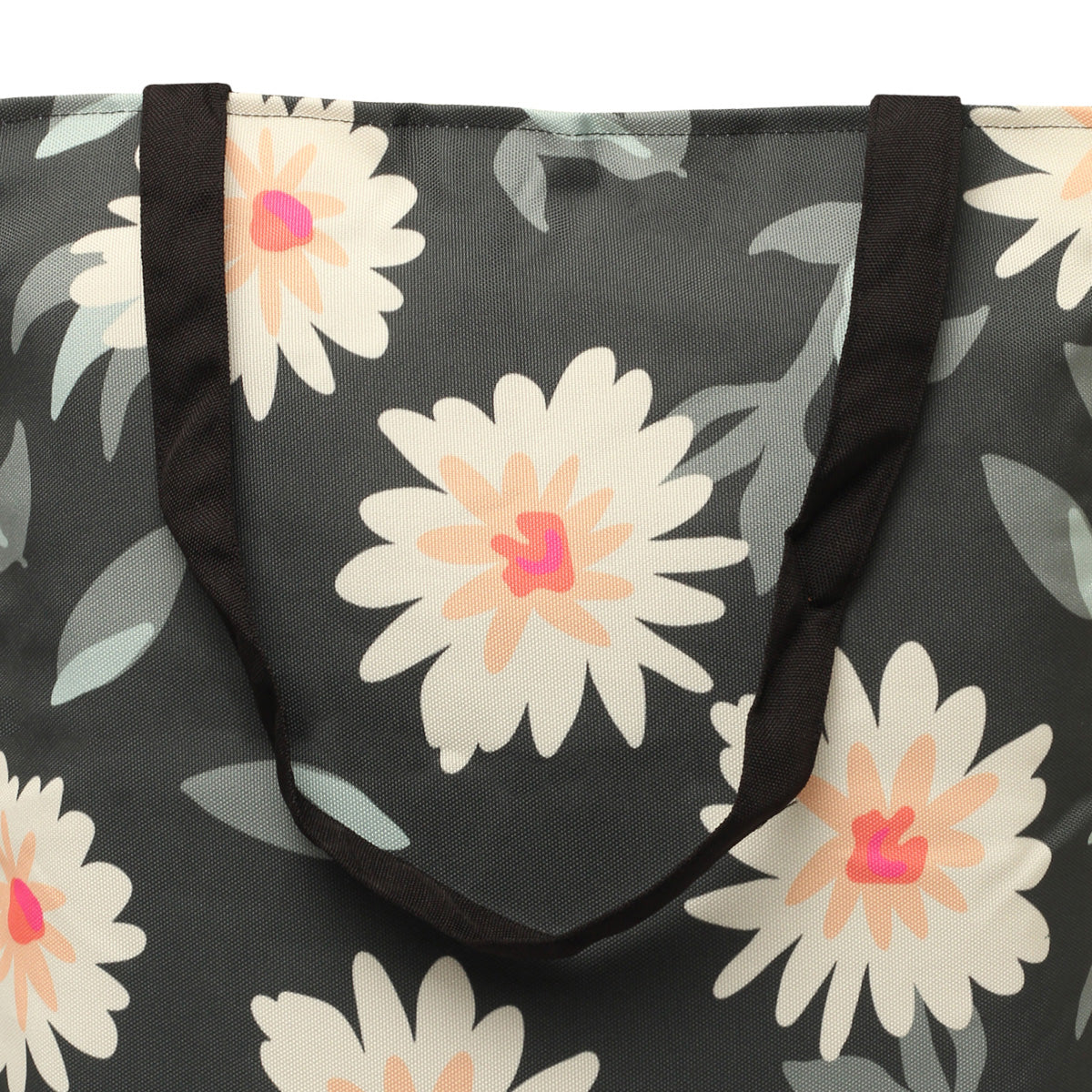  A tote bag featuring a colorful flower pattern, perfect for carrying essentials on a sunny day out.