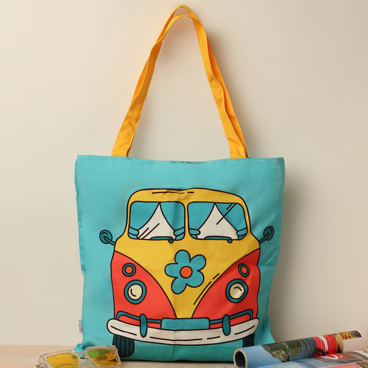  Colorful tote bag with a whimsical bus illustration, ideal for carrying your essentials in style.