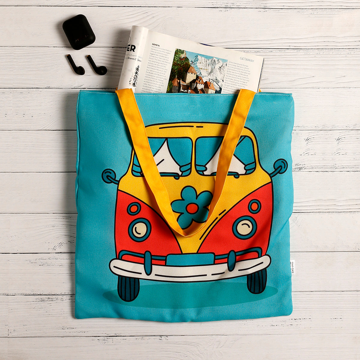 A vibrant tote bag featuring a cute cartoon bus design, perfect for adding a pop of color to your outfit.