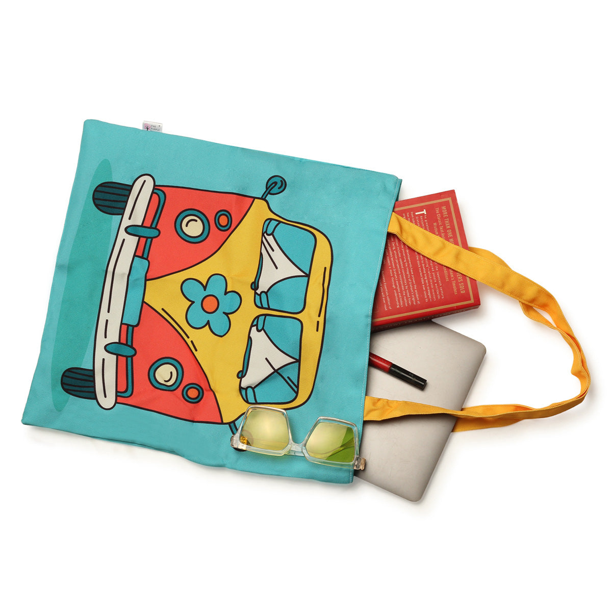 Brighten up your day with this tote bag showcasing a colorful bus decorated with beautiful flowers.