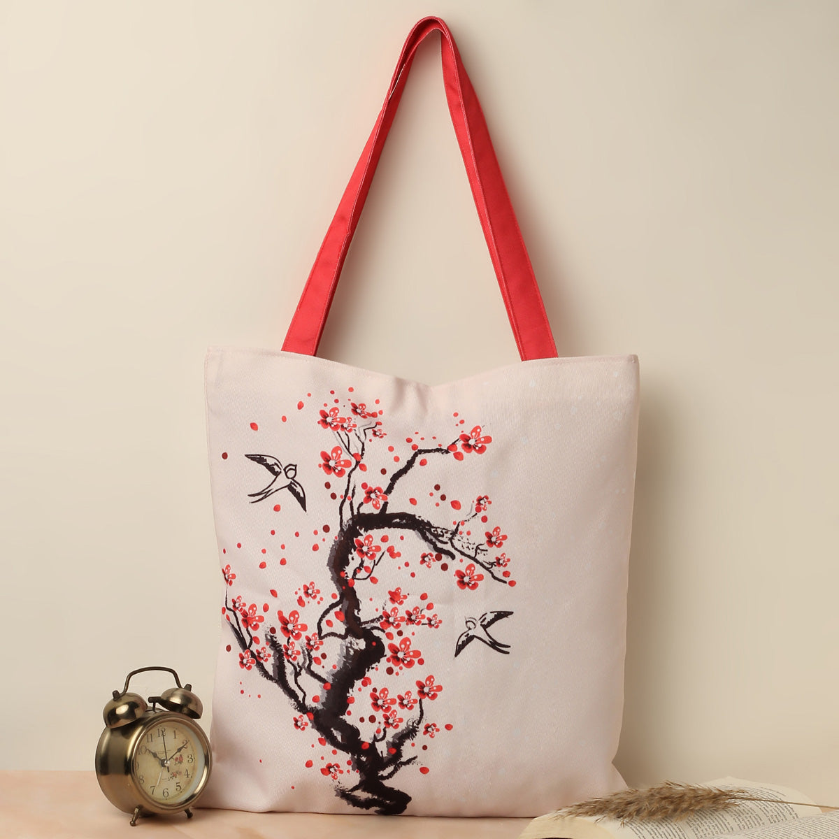 Tote bag with a beautiful bird and cherry blossom pattern, ideal for nature lovers on the go.