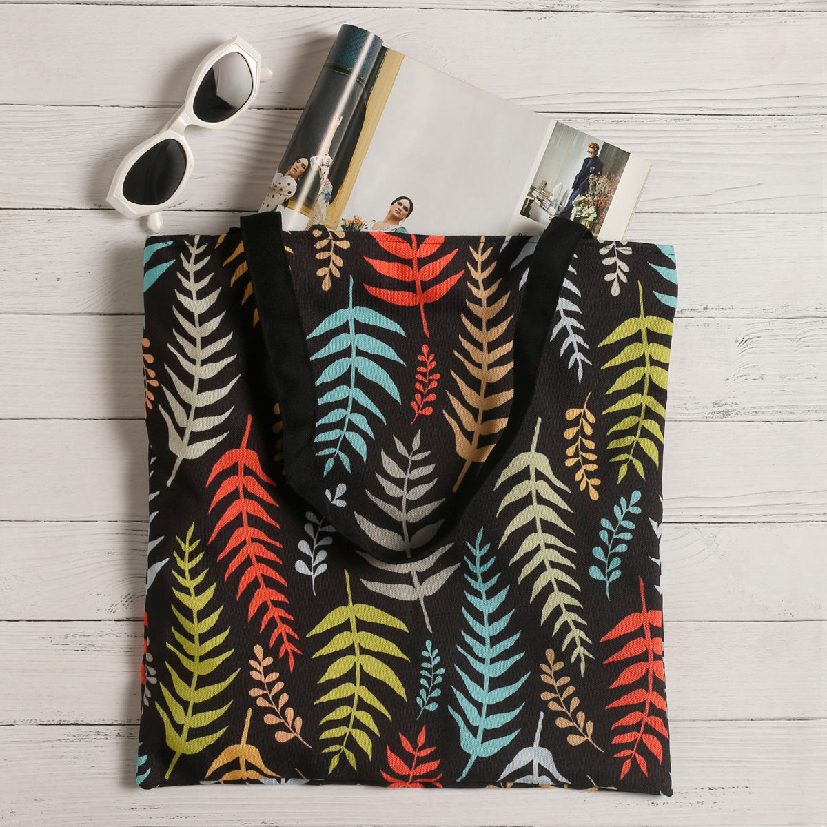 A tote bag featuring vibrant leaves.