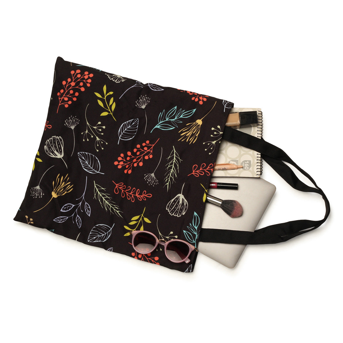 A black tote bag with autumn leaves and berries.