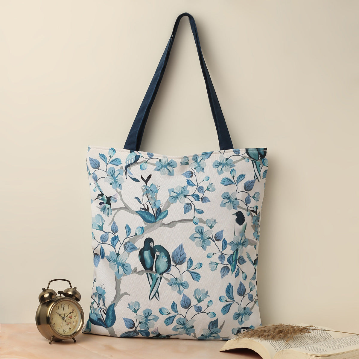 Blue and white tote bag featuring charming bird illustrations.