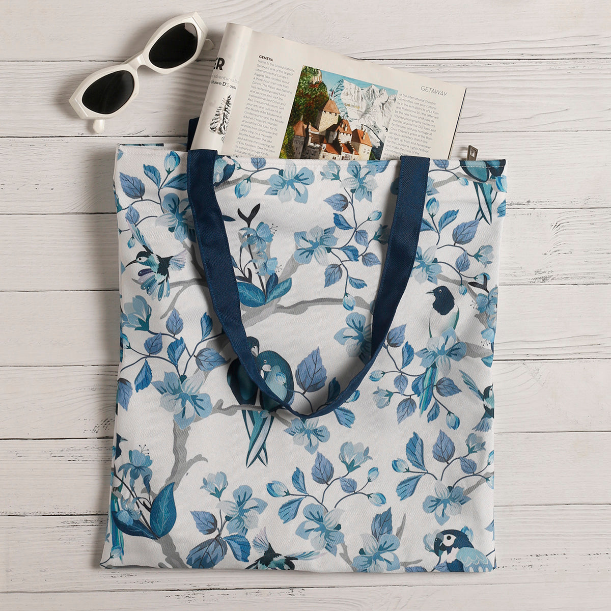 Stylish tote bag in blue and white with adorable bird design.