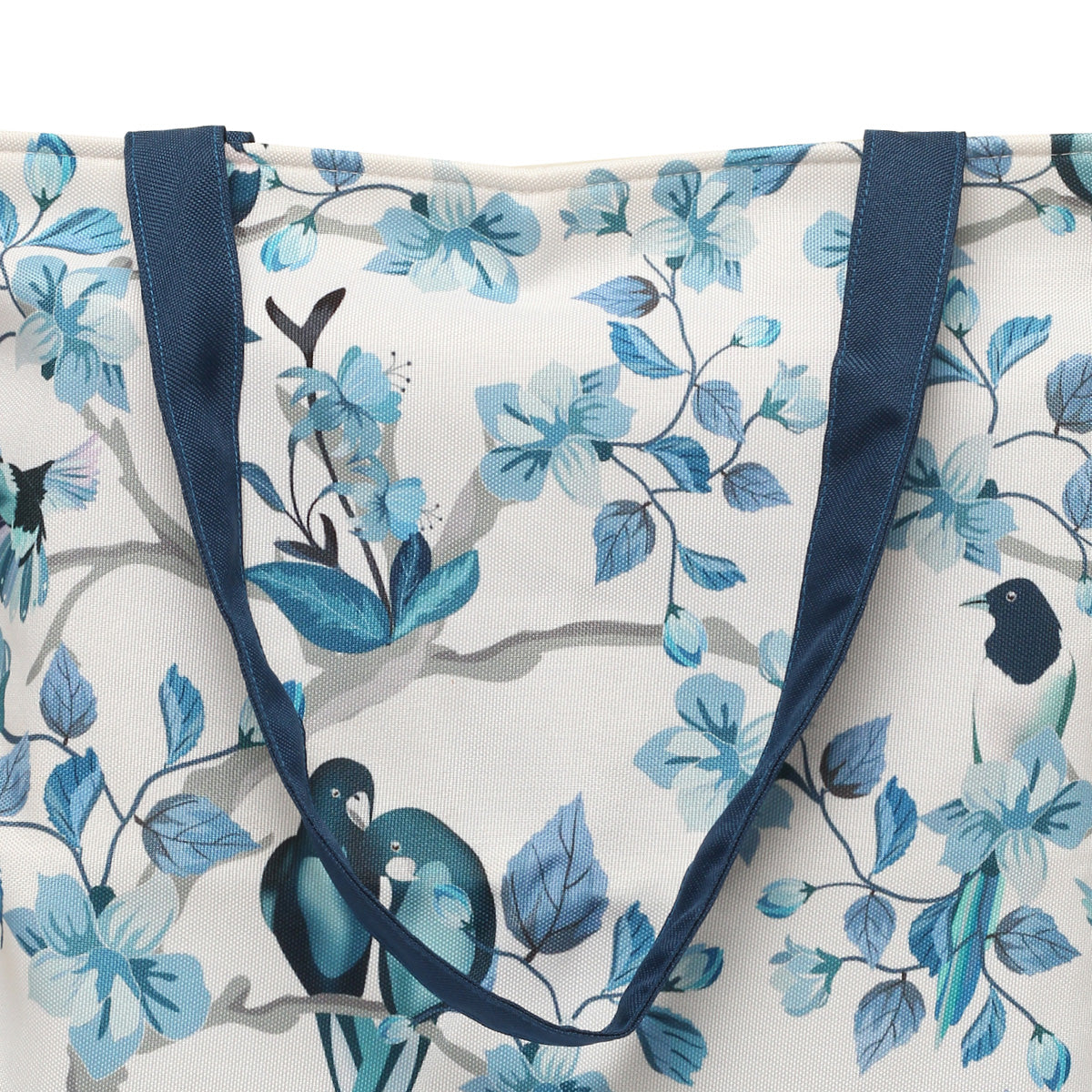 Elegant tote bag with blue and white color scheme and bird motif.