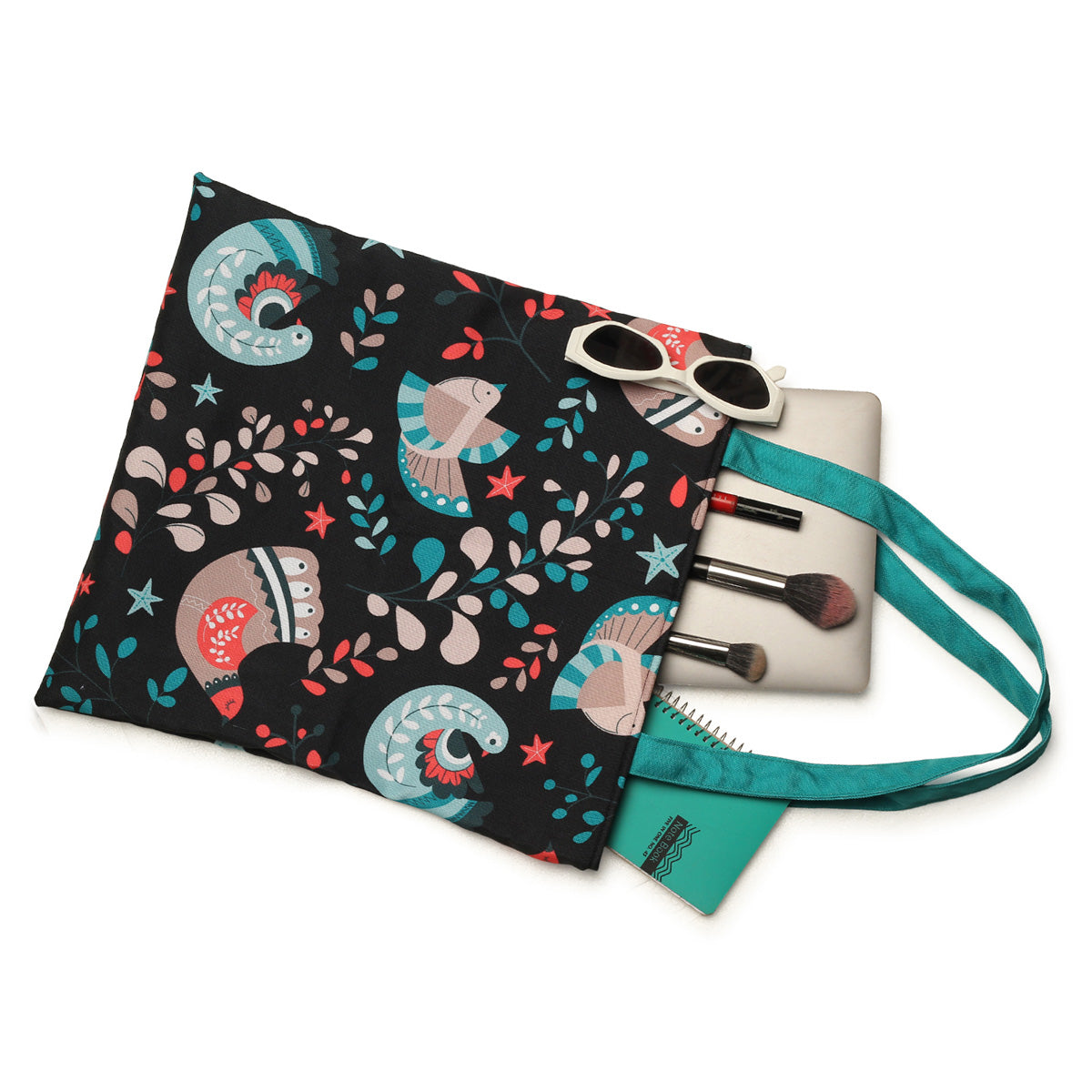 Black and turquoise tote bag adorned with a vibrant pattern of birds and leaves, ideal for casual outings.