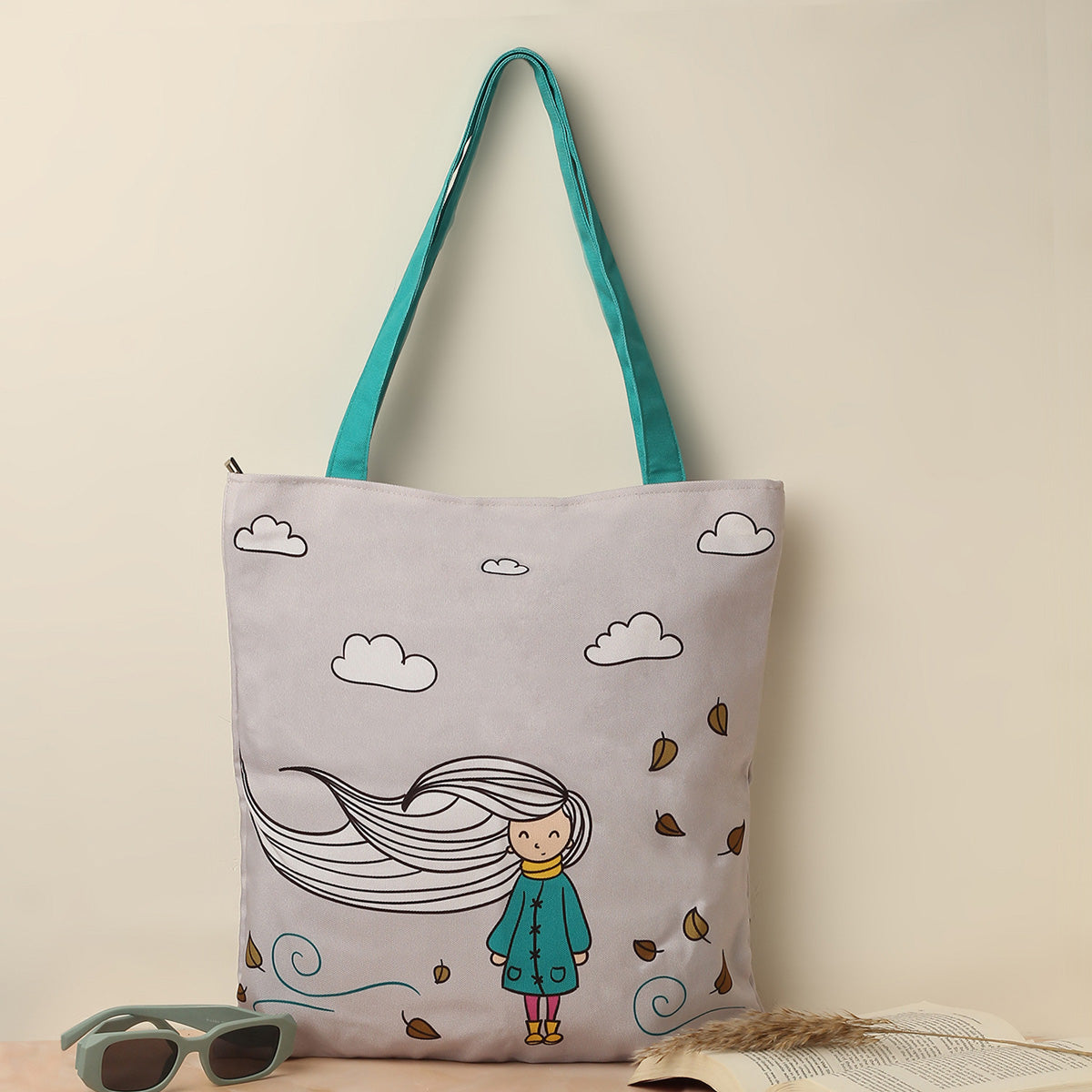 A colorful tote bag featuring a cartoon girl surrounded by fluffy clouds, perfect for casual outings and everyday use.